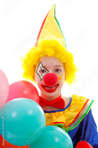 child dressed as colorful funny clown over white background