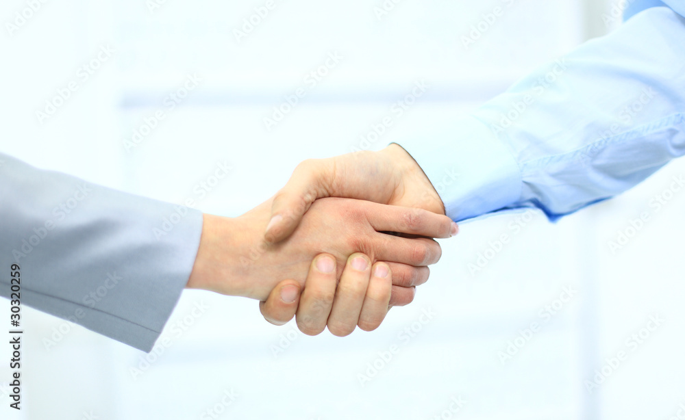 Business men hand shake in the office Business men hand shake in the office