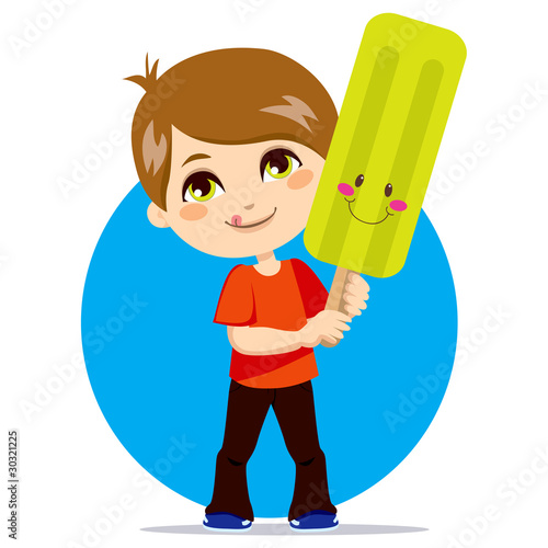 Little boy eating a sweet a...