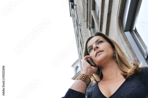 Business woman talking on mobile phone photo