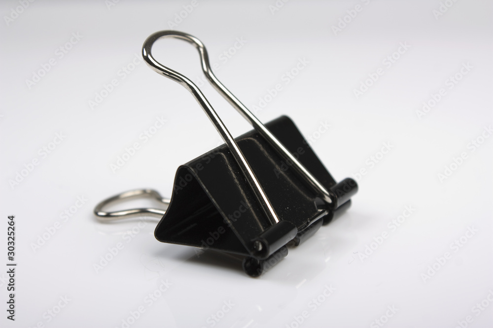 Small Bulldog Clip on its side with natural shadows Small Bulldog Clip on its side with natural shadows