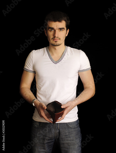 Broke guy showing emptu wallet photo