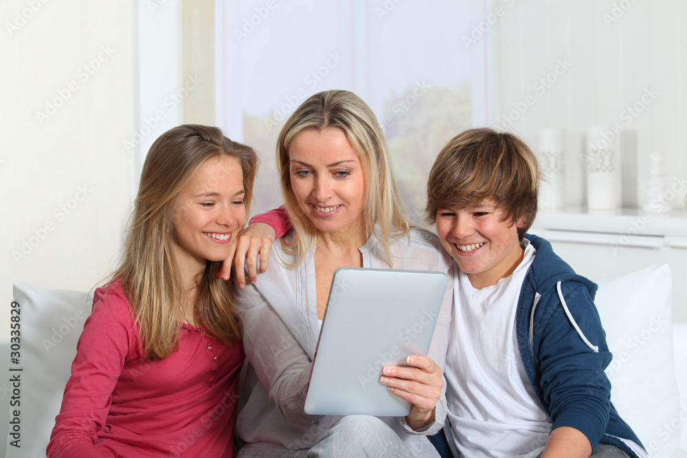 Family having fun at home using electronic tablet Family having fun at home using electronic tablet