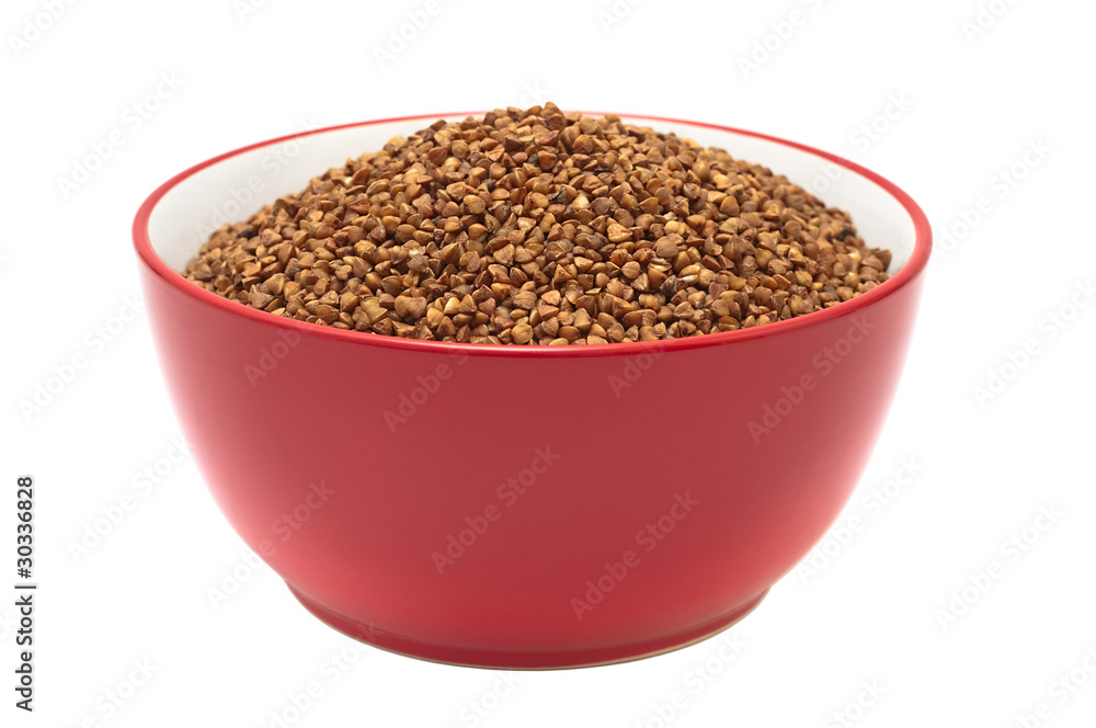 Soup plate with dry buckwheat isolated on white background Soup plate with dry buckwheat isolated on white background