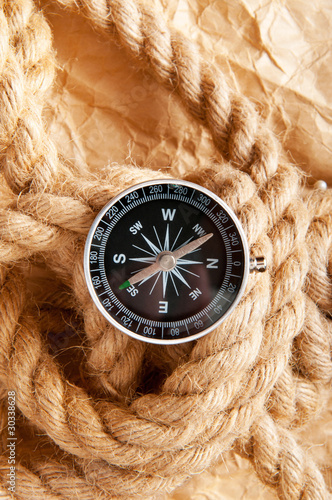 Compass and rope in travel and adventure concept