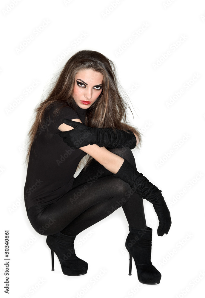 Young beautiful woman in black combi dress and velvet gloves, ri