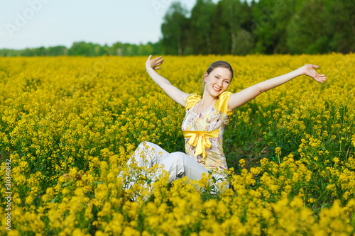 happy woman on yellow field © p_r_g