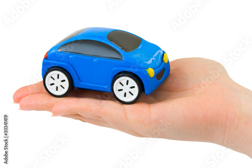 Hand and toy car