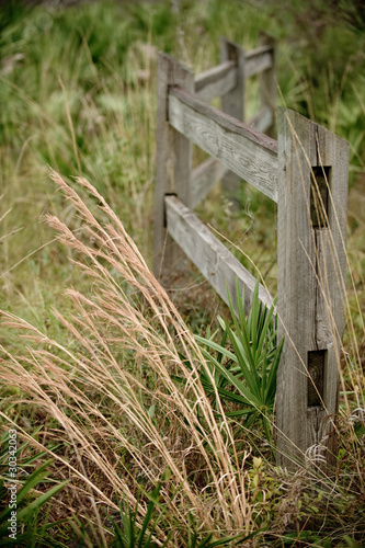 wooden fence in field