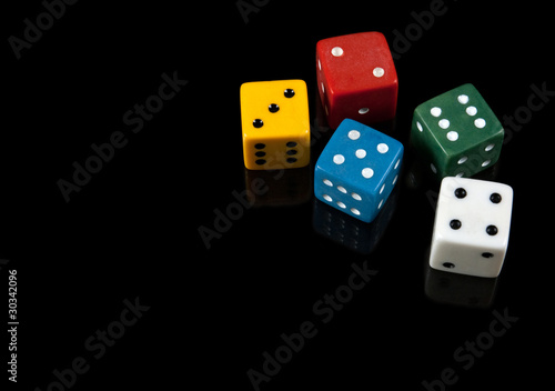 Colorful dices on black background