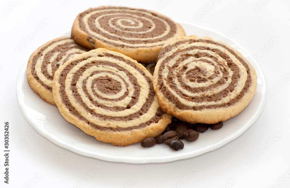 black and white cookies with coffee beans on the plate