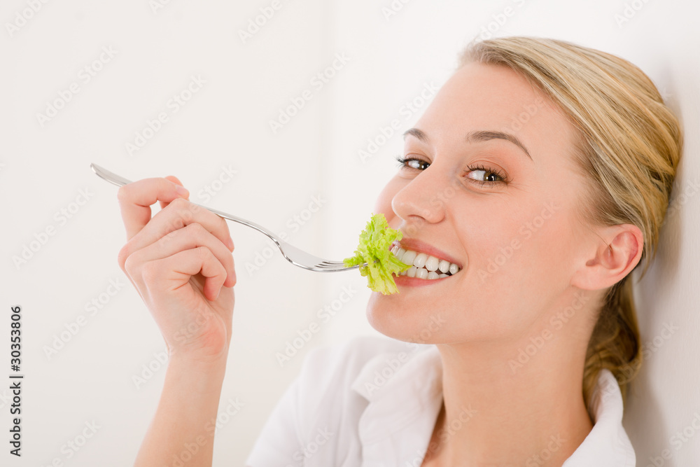 Healthy lifestyle - young woman with lettuce Healthy lifestyle - young woman with lettuce
