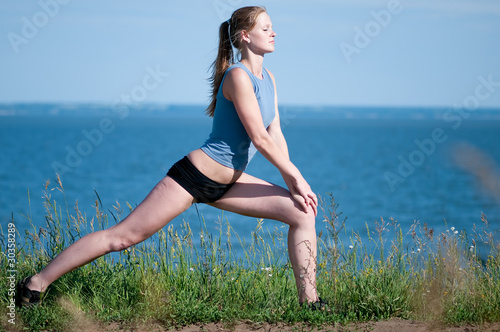 Sport woman doing stretching exercise. Yoga