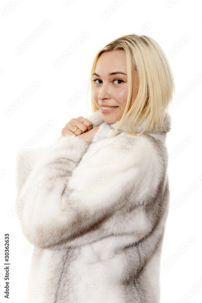 The young beautiful blonde in a fur coat The young beautiful blonde in a fur coat