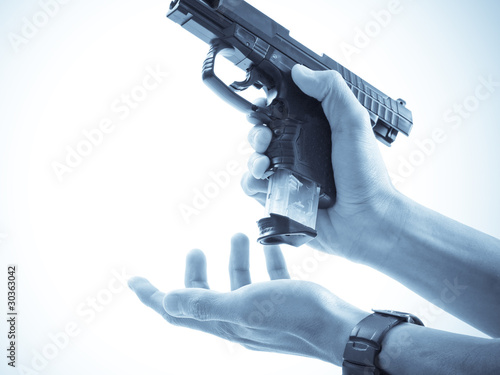 Unclipping The Handgun photo