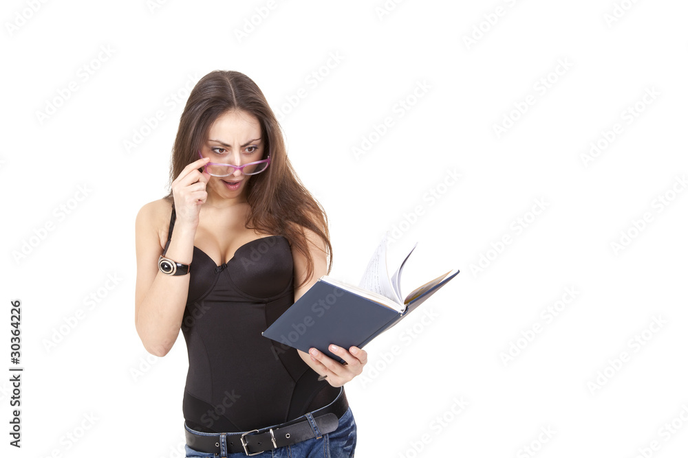 Surprised pretty girl with book, pen and glasses Surprised pretty girl with book, pen and glasses
