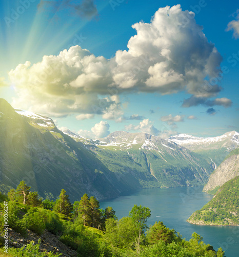 Summer landscape. Blue sky  mountains and fjord