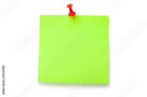 Green fluorescent sticker on red thumbtack