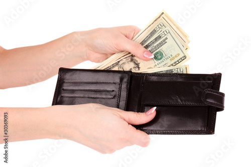 red purse with dollars in the hands on a white background