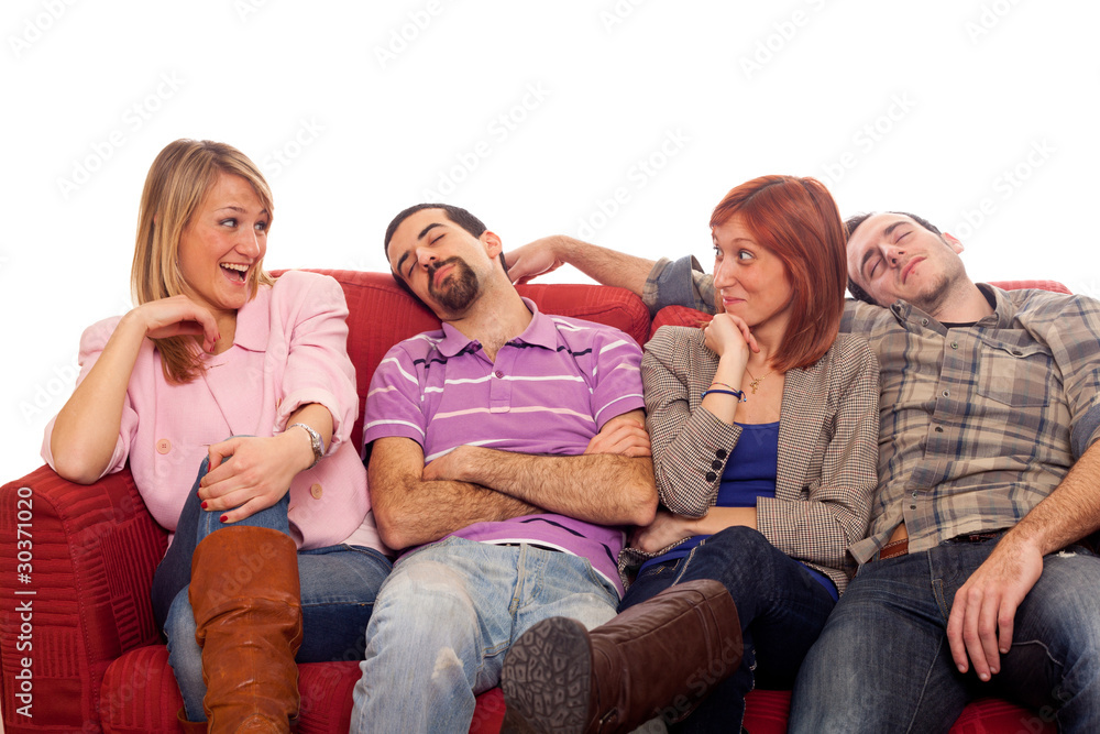 Girls Laughing while Boys Sleep on Sofa