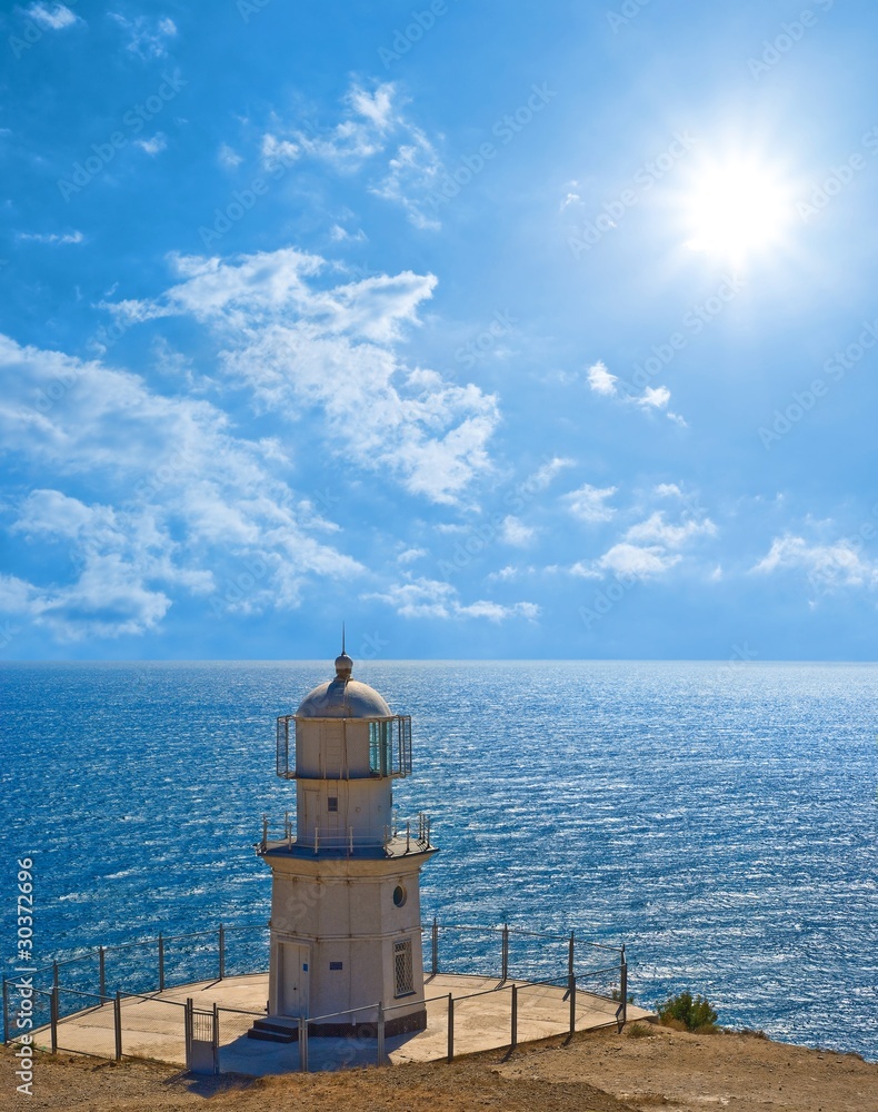 lighthouse on a sea cape by a sparkle day lighthouse on a sea cape by a sparkle day