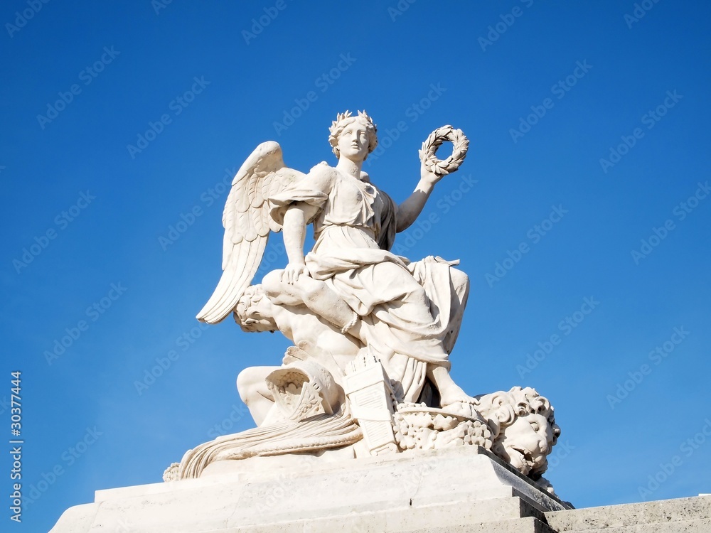 Statue at facade of Versailles Chateau entrance