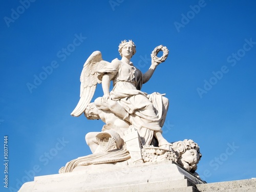 Statue at facade of Versailles Chateau entrance