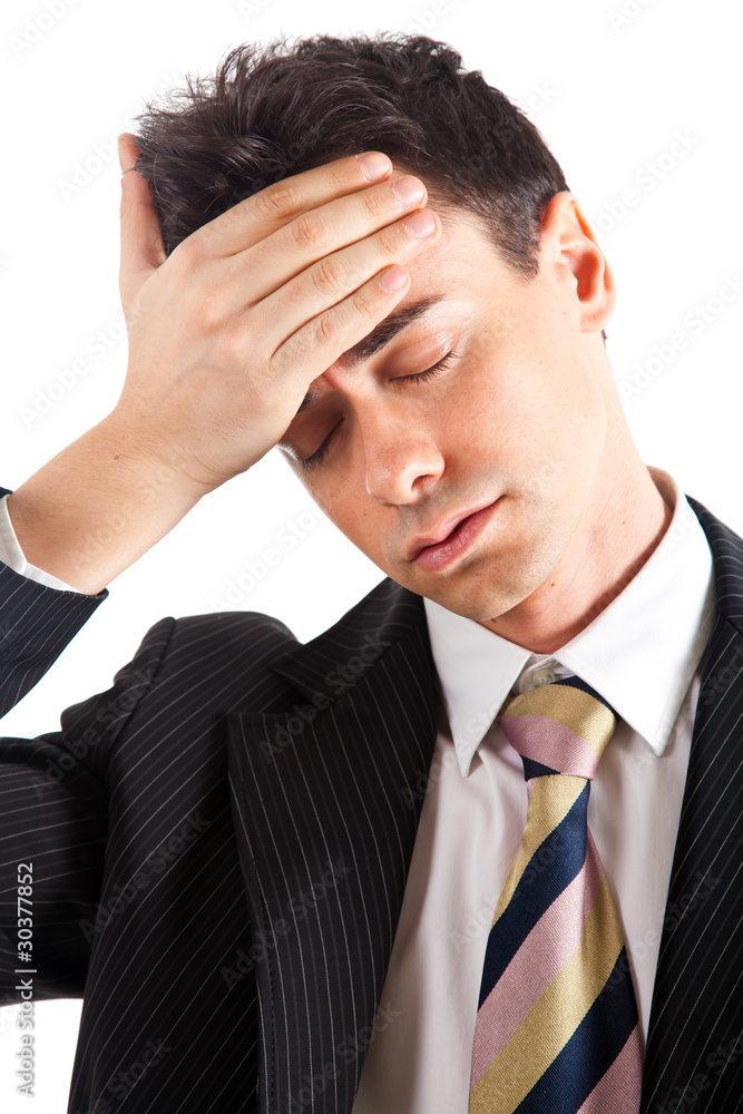 Young unhappy businessman holds his head, stress Young unhappy businessman holds his head, stress