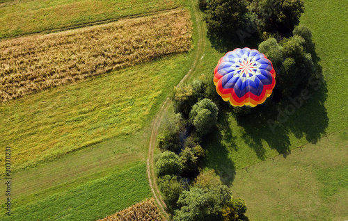 Over the fields in hot air balloon.