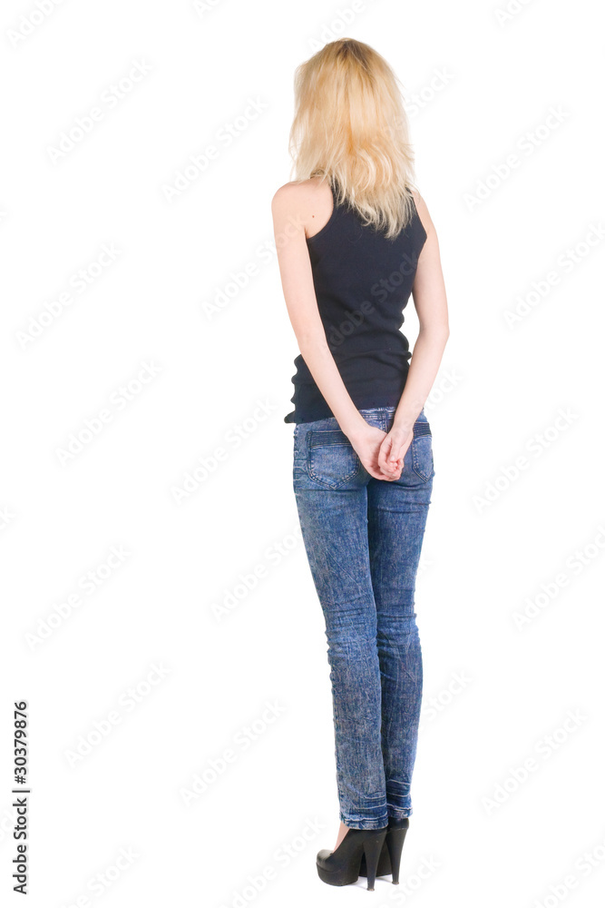 Obraz premium Beautiful young woman looking at wall.