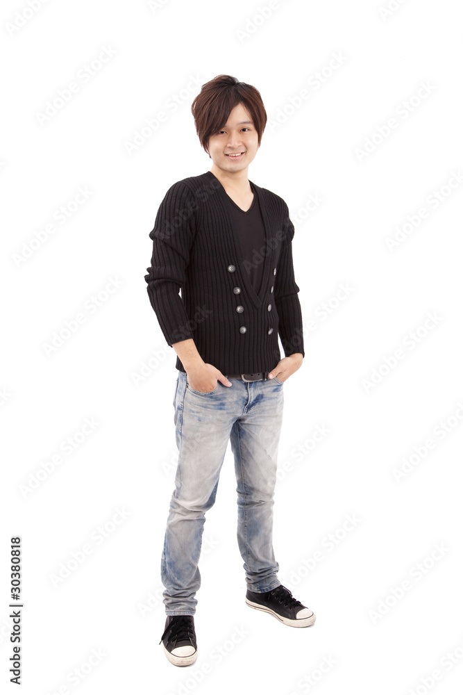 Asian young man standing with hands in pockets Asian young man standing with hands in pockets