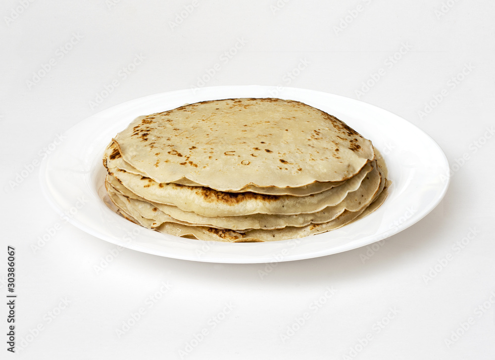 yellow pancakes on a white plate yellow pancakes on a white plate