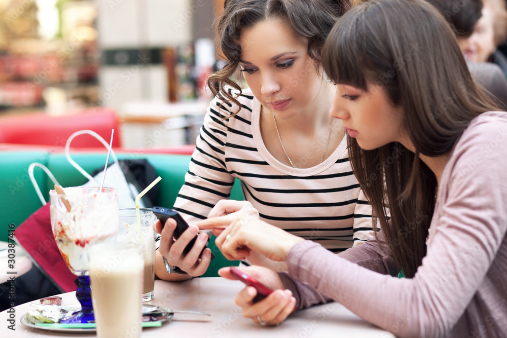 Two young pretty girls talking
