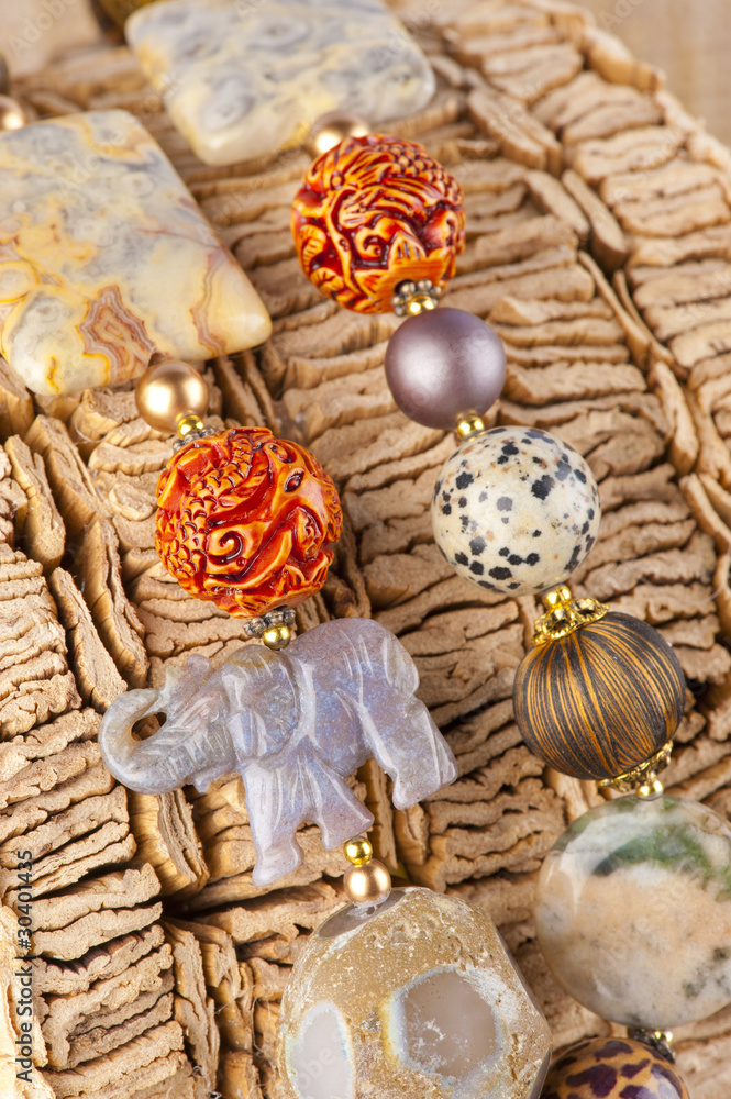 Etchnic necklace on wooden background Etchnic necklace on wooden background