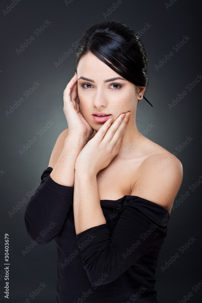 Fototapeta premium woman holding her face in hands