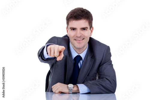 business man at his desk pointing photo