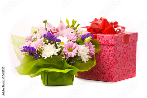 Magnificent bouquet and present box on a white