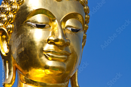 Golden Buddha under the open sky
