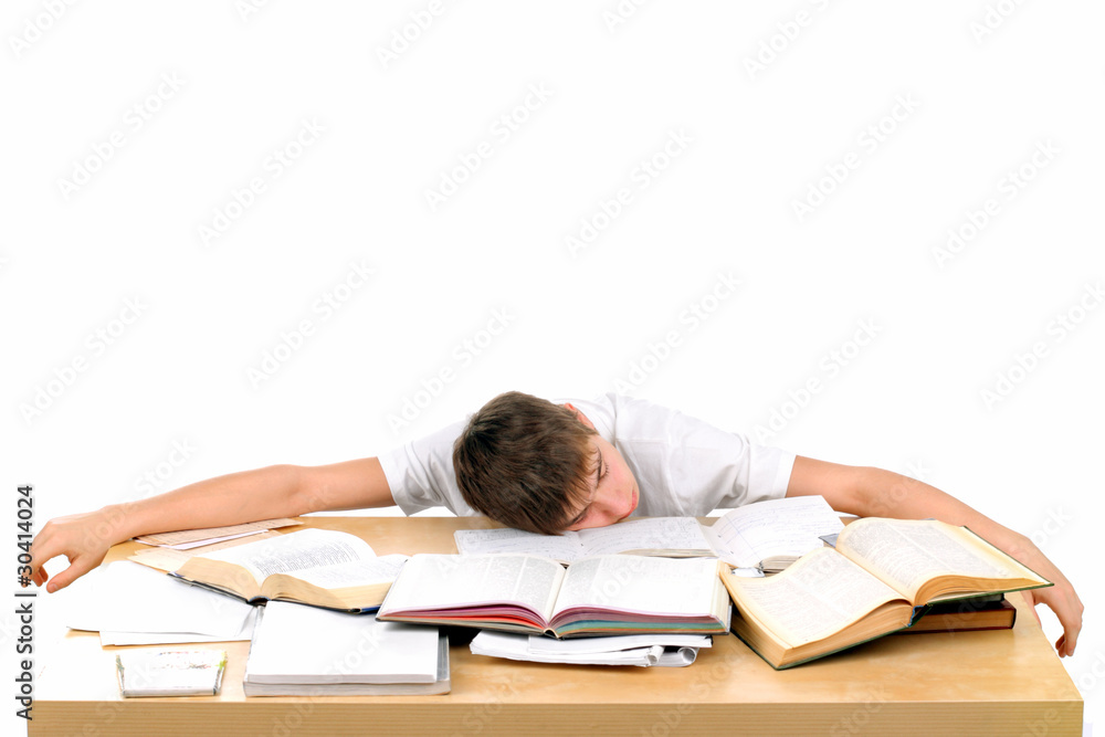 tired teenager lying and sleeping on the books tired teenager lying and sleeping on the books