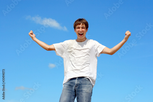 happy teenager on blue sky background