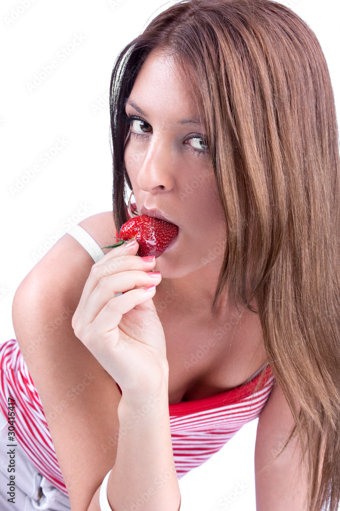 Young woman are eating fresh strawberry Young woman are eating fresh strawberry