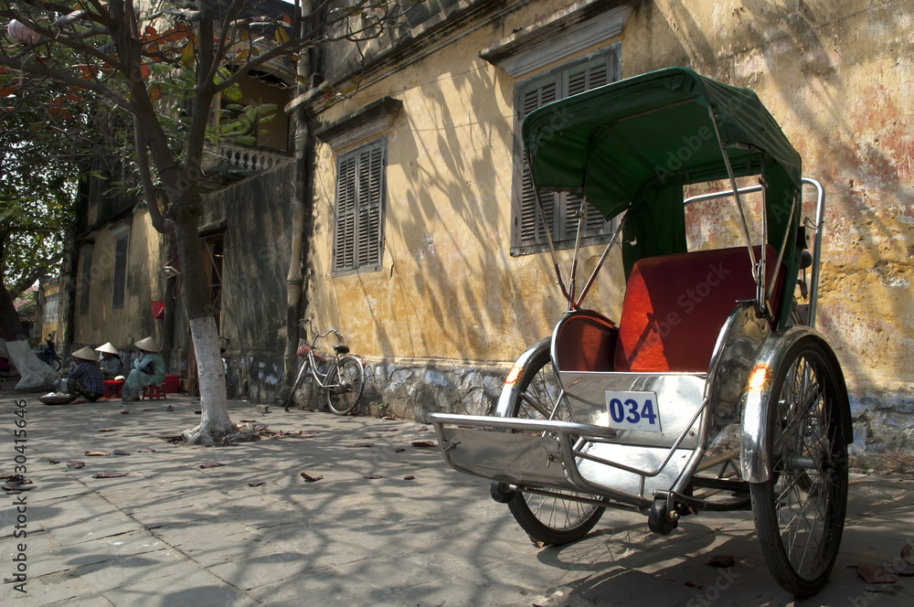 Hoi An Vietnam old Cyclo in front of an ancient house