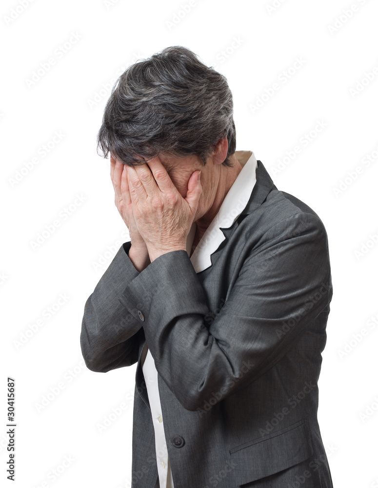 desperate mature businesswoman hiding her face isolated desperate mature businesswoman hiding her face isolated