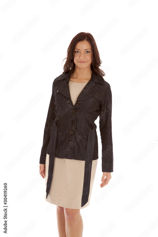 Woman black top tan dress standing Woman black top tan dress standing