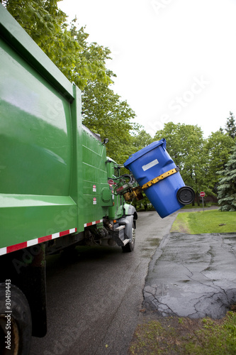 Recycling truck picking up bin