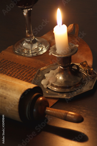 Ancient manuscript in the light of candles