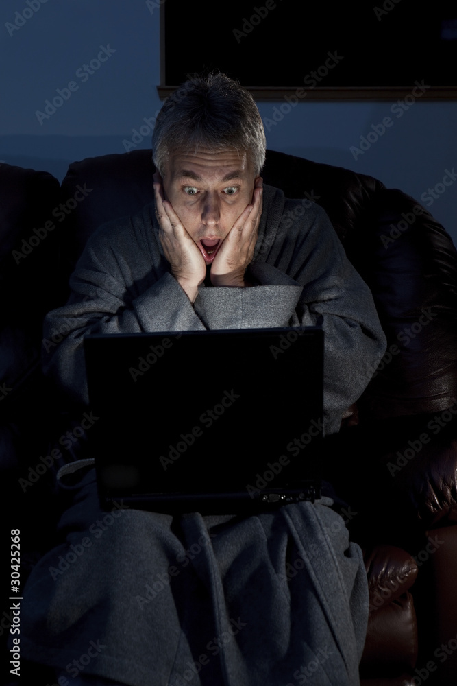 Man in housecoat working late series surprised Man in housecoat working late series surprised