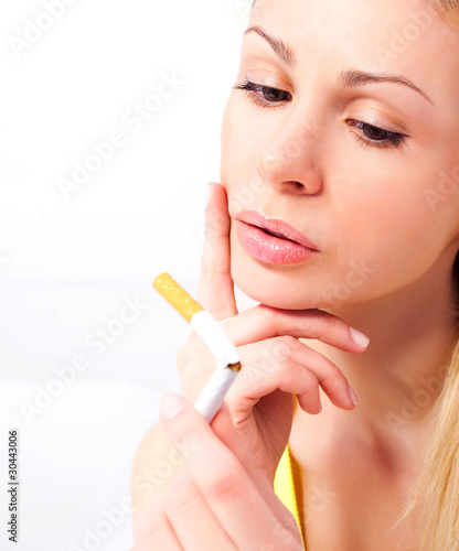 woman breaking a cigarette