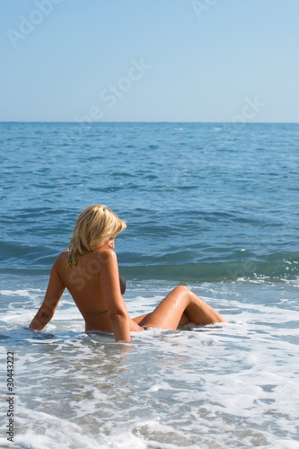 Girl among the ocean waves. © Stanislav Komogorov