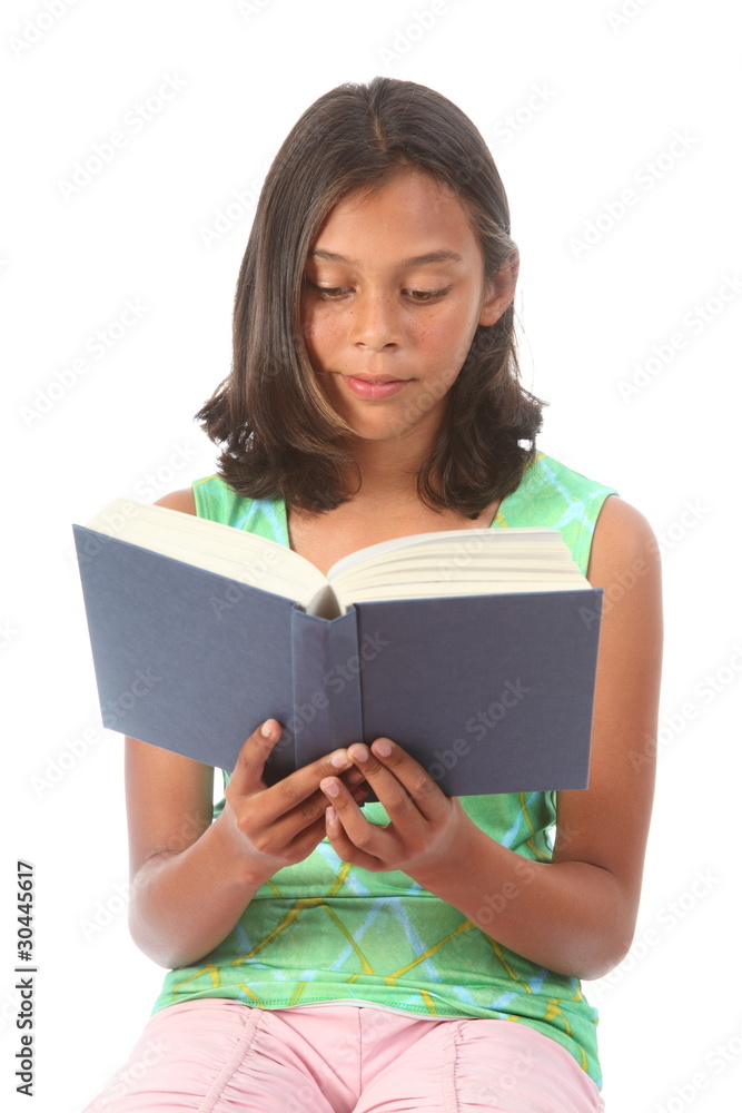 Teenage girl reading a blue book Teenage girl reading a blue book